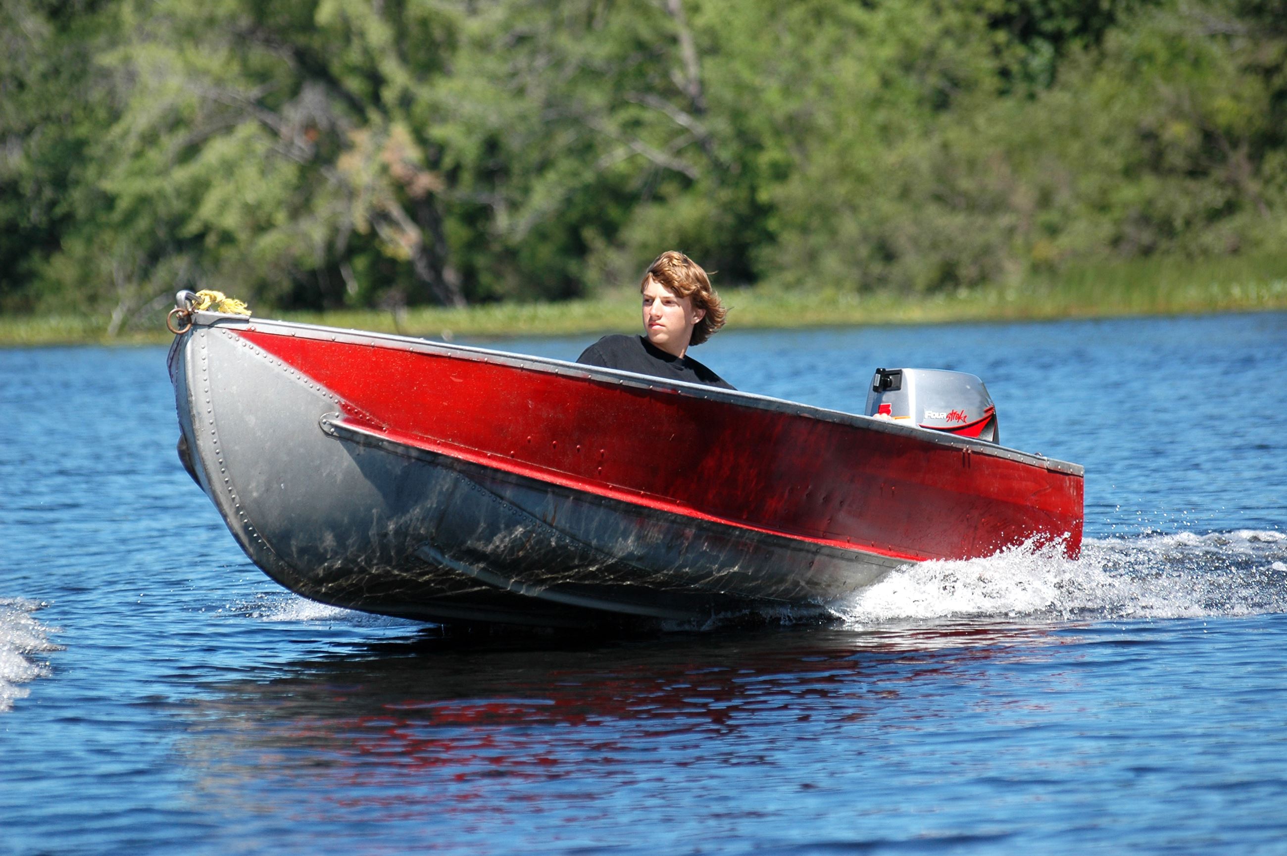 kid driving boat 1