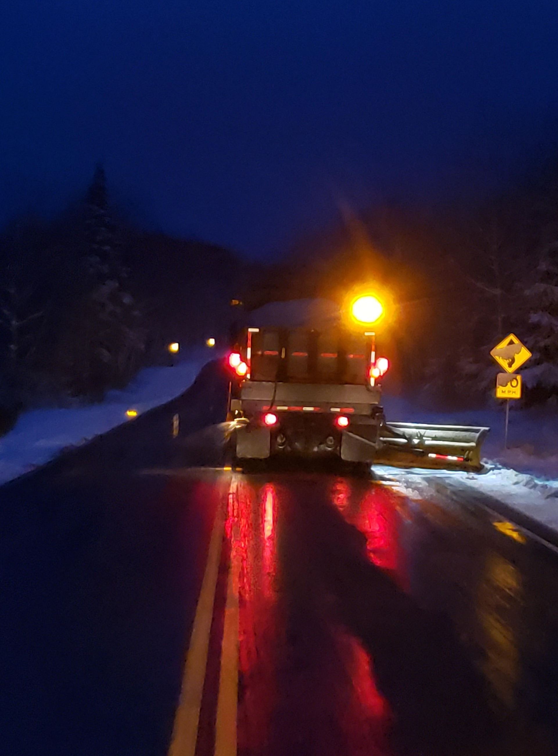 Snowplow driving in the dark